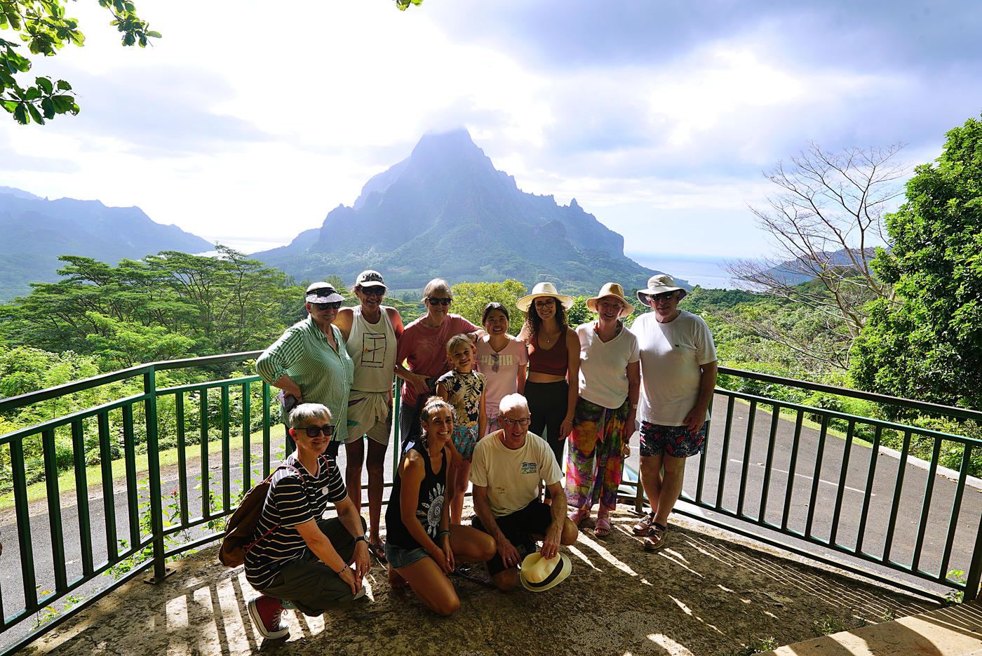 A group at the Belvedere lookout with Moorea's jagged peaks behind